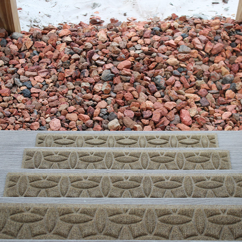 Descending stairs outdoors with WaterHog Ellipse stair treads across each step.