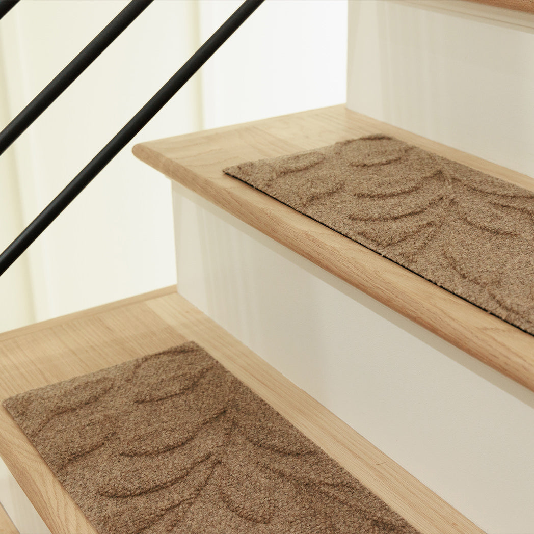 Thin WaterHog stair treads on wooden stairs offering floor protection