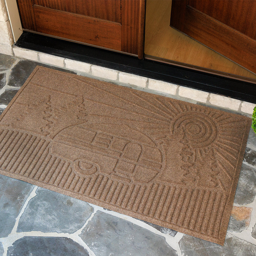 Fade-resistant camper doormat on a stone porch
