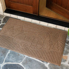Fade-resistant camper doormat on a stone porch