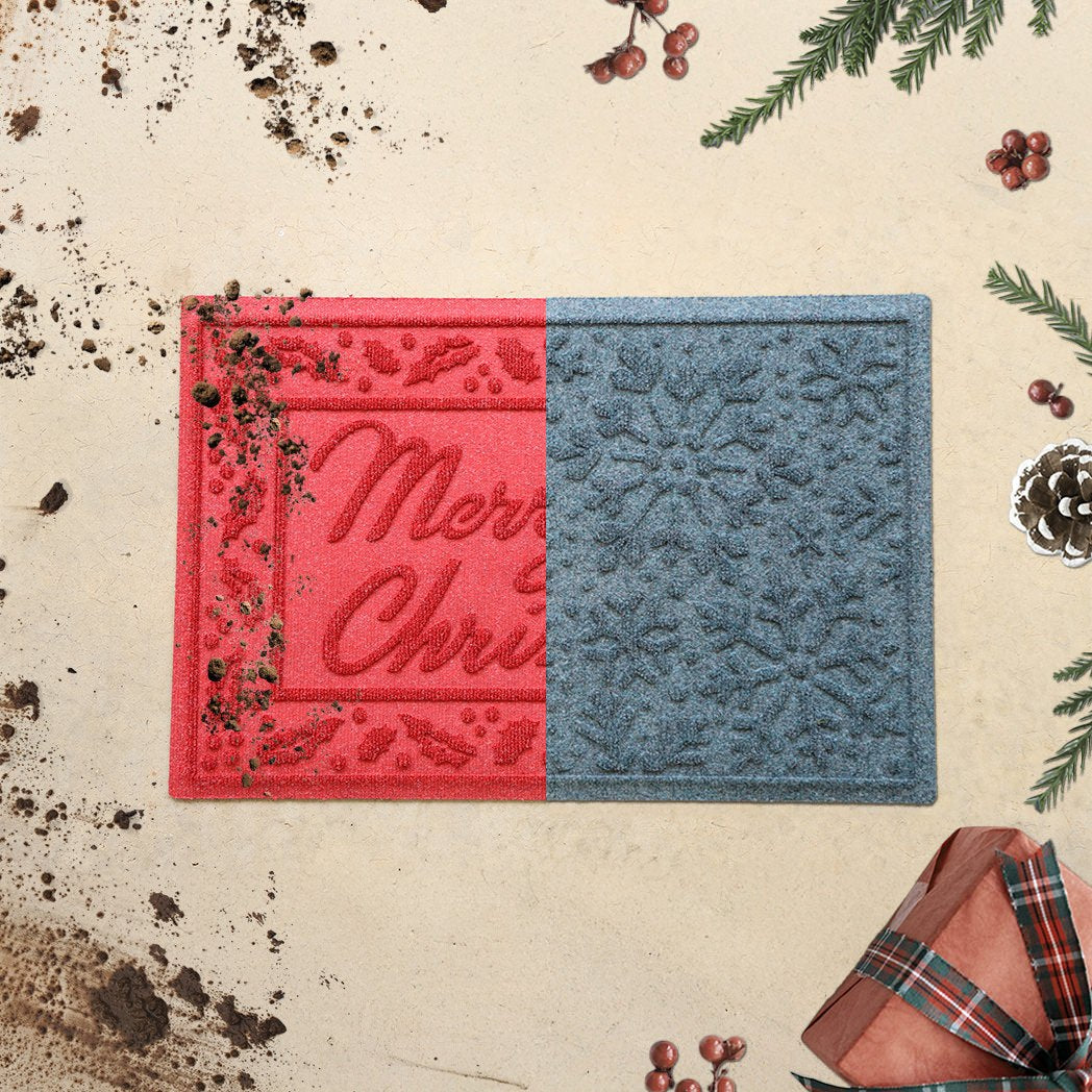 Half images of a bright red Merry Christmas door mat and a light blue Snowflakes design, with dirt on the right and holiday decor on the left