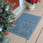WaterHog's Snowflakes winter-ready doormat in bluestone place at a front door for dirt trapping