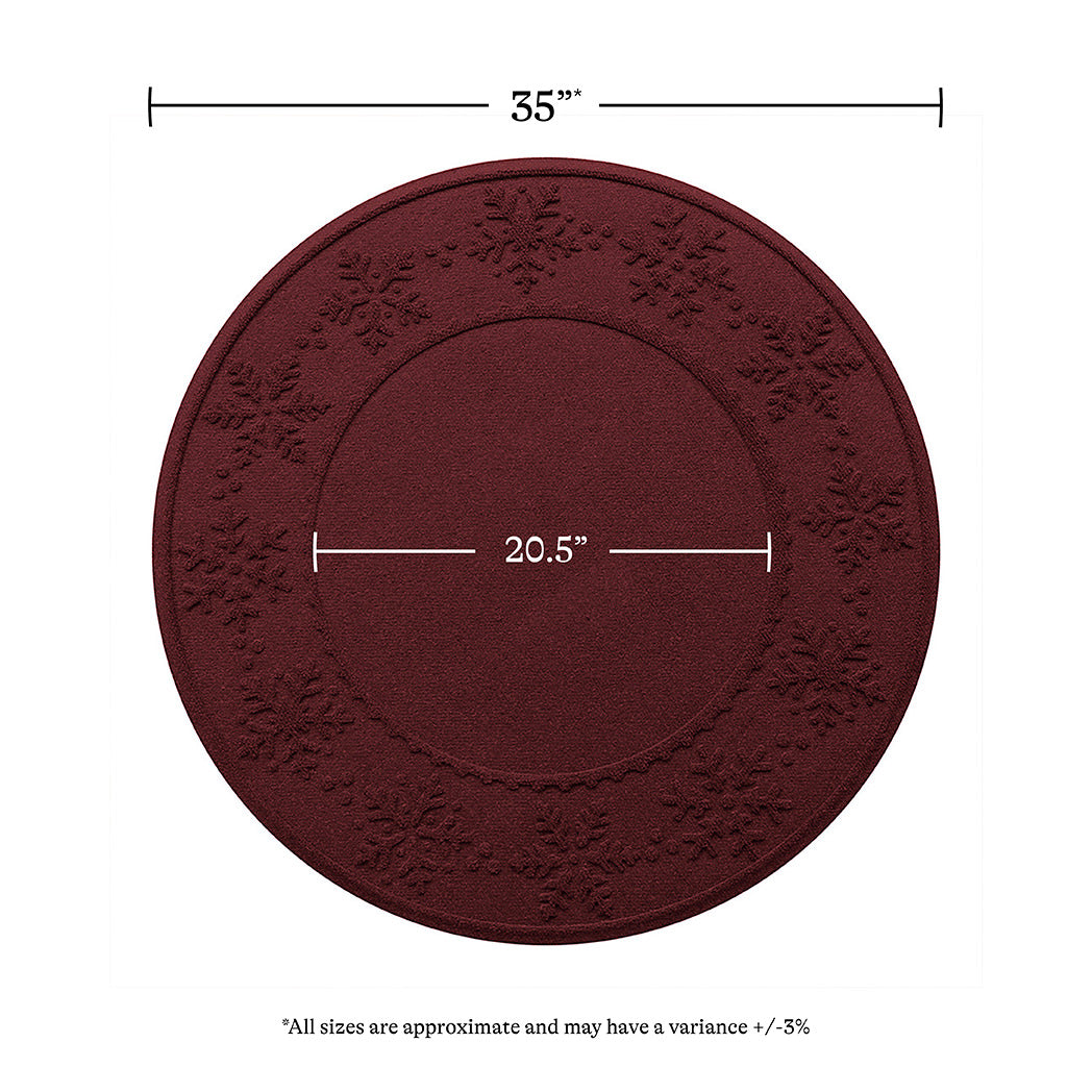 Overhead of the cranberry Snowflakes tree skirt showing the full width of 35 inches and an inner circle of 20.5 inches