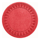 Overhead of a bright red tree skirt with a tree design on the rounded mat on a solid white background