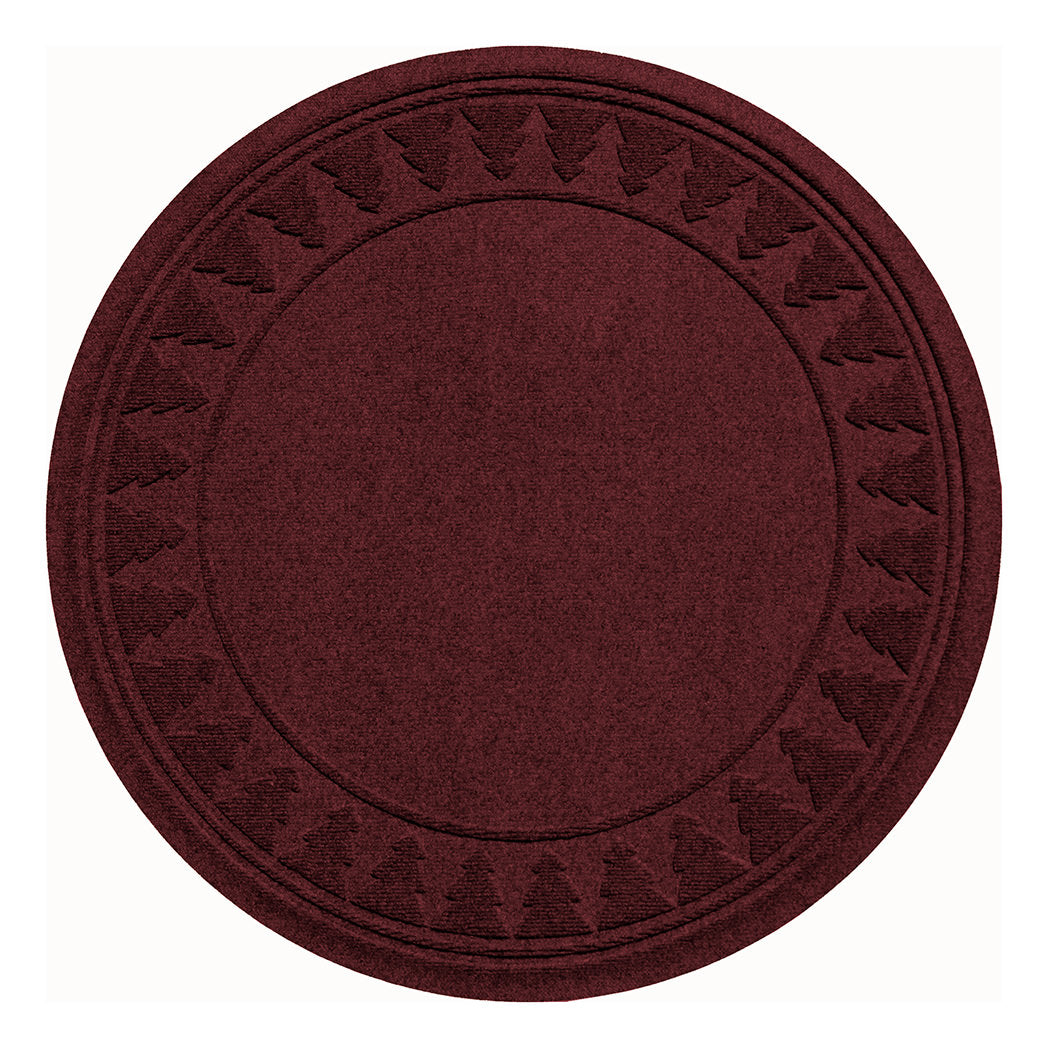 Overhead of a deep red WaterHog tree skirt with a tree stamp pattern around the edge on a white background