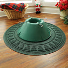 WaterHog Tree Skirt with a tree pattern on the rim with a green Christmas tree stand in the middle