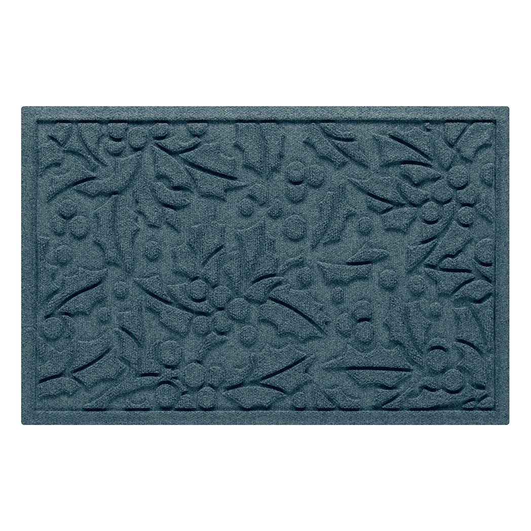 Blue doormat with holly pattern on a white background
