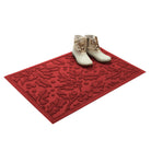 Red holiday doormat with white boots on a white background