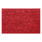 Bright red doormat with holiday holly pattern on a white background