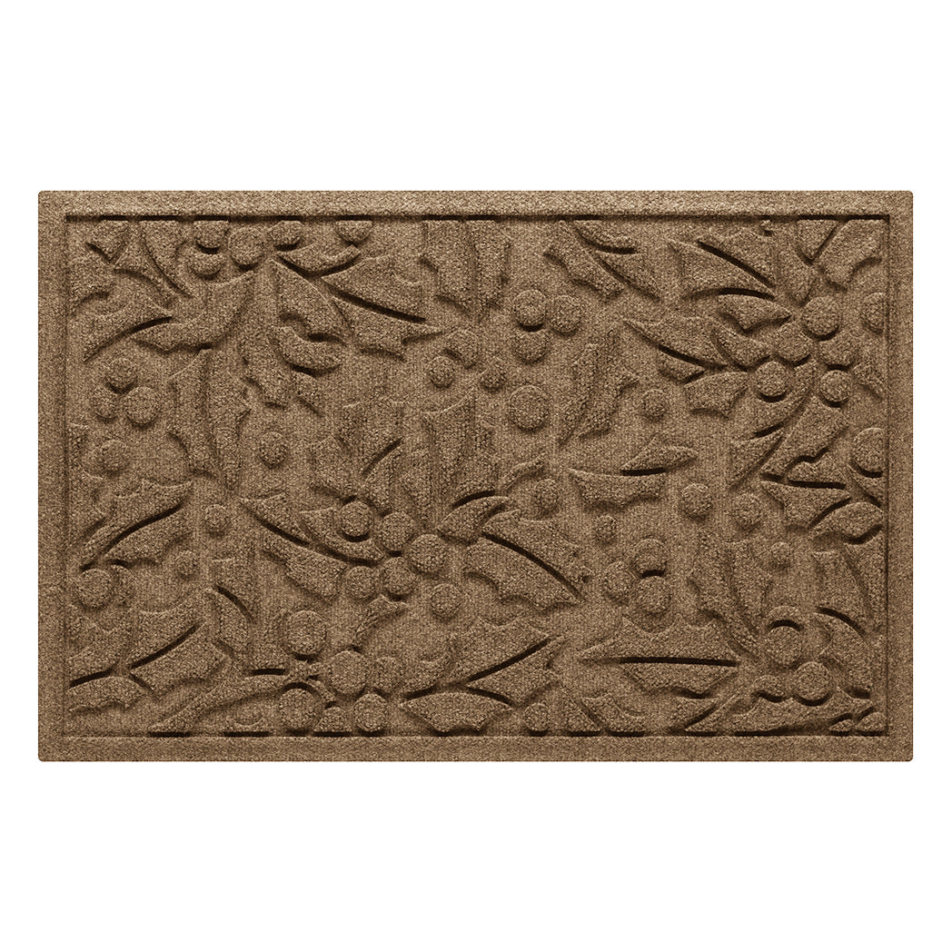 Tan/beige doormat with holiday holly pattern on a white background