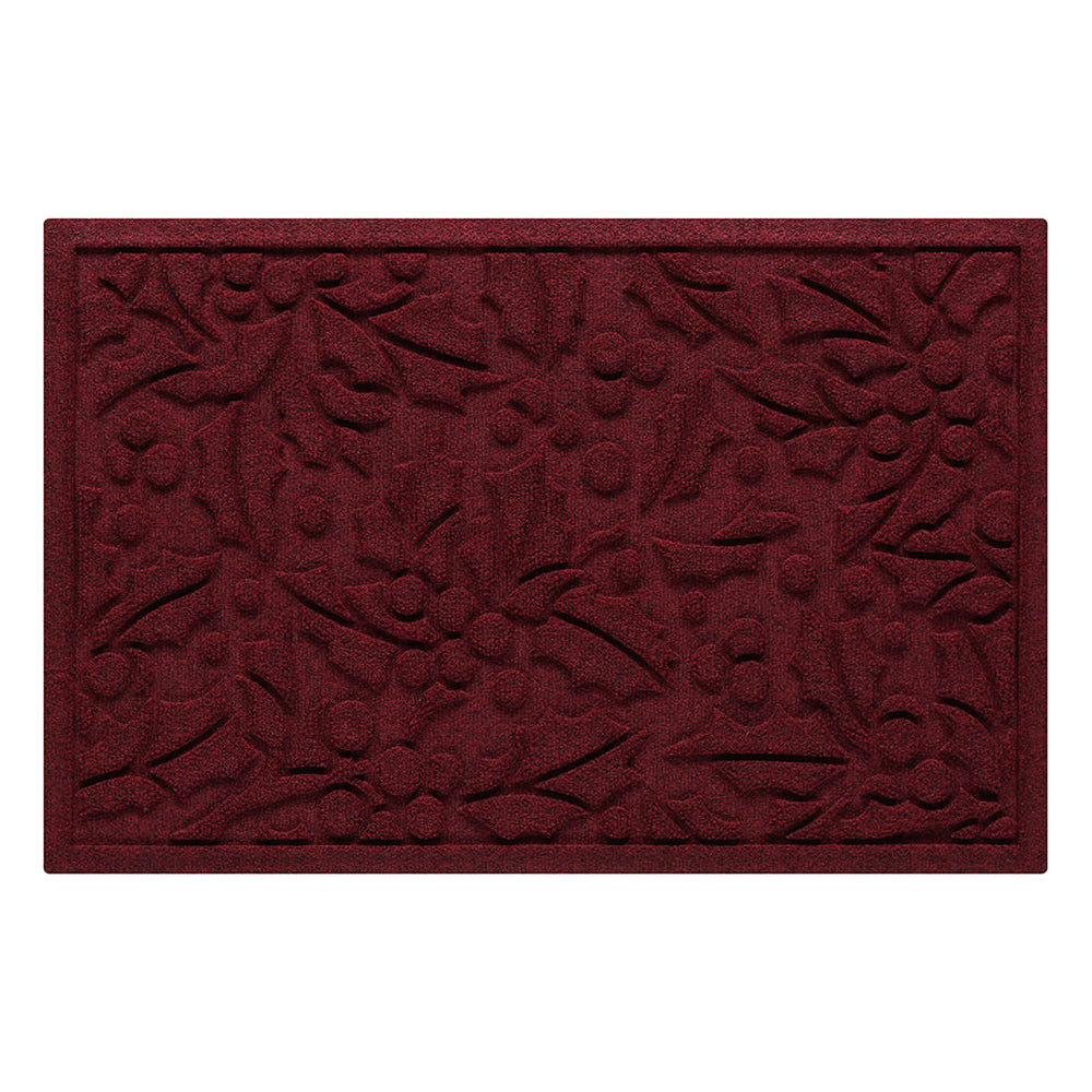 Deep red doormat with holiday holly pattern on a white background