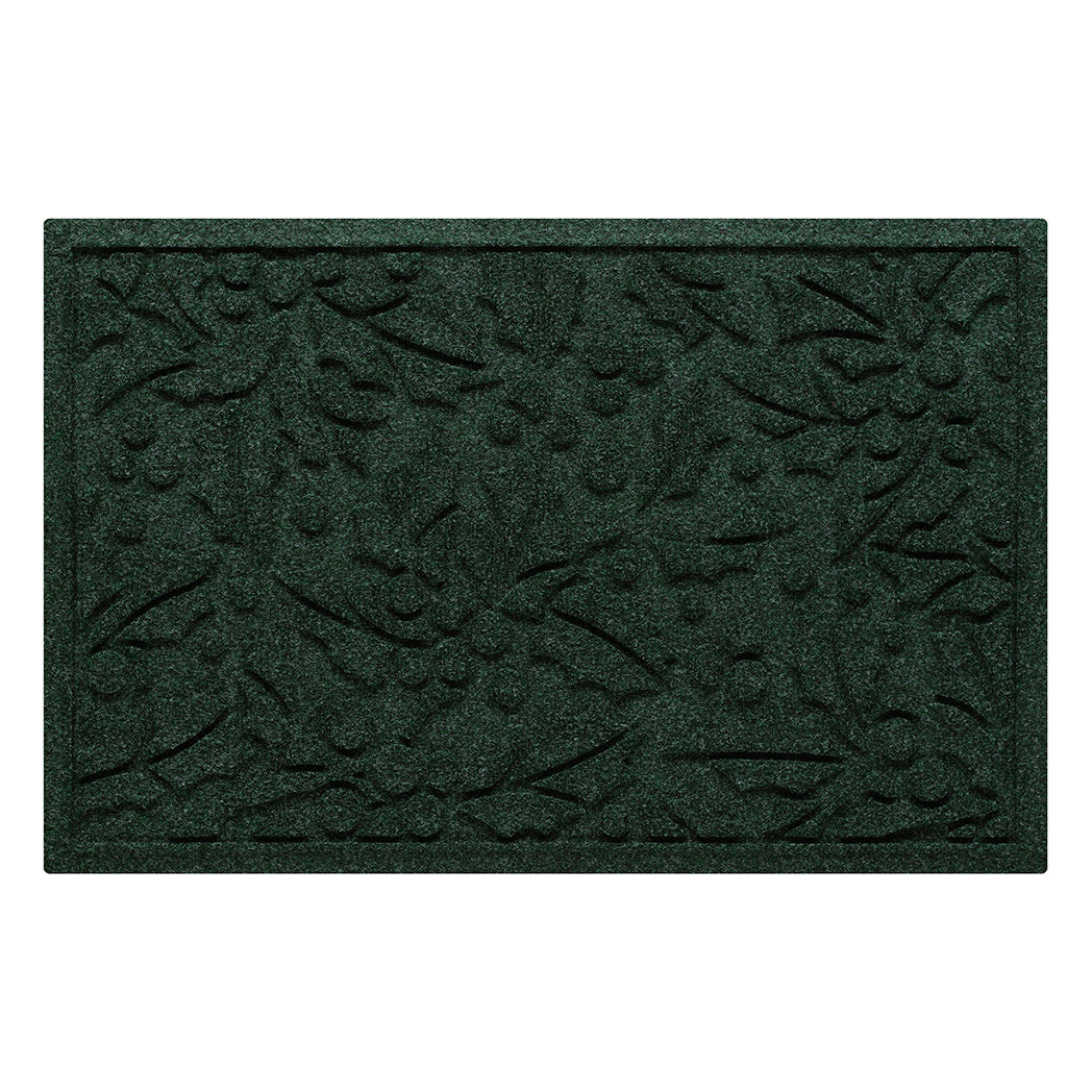 Dark green doormat with a bi-level holiday leaf pattern on a white background