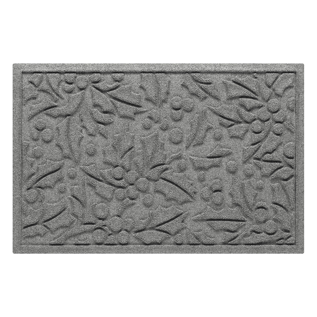 Gray indoor/outdoor doormat with holiday holly pattern on a white background