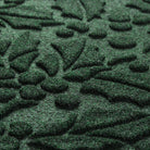 Close-up of a textured green mat with leaf patterns