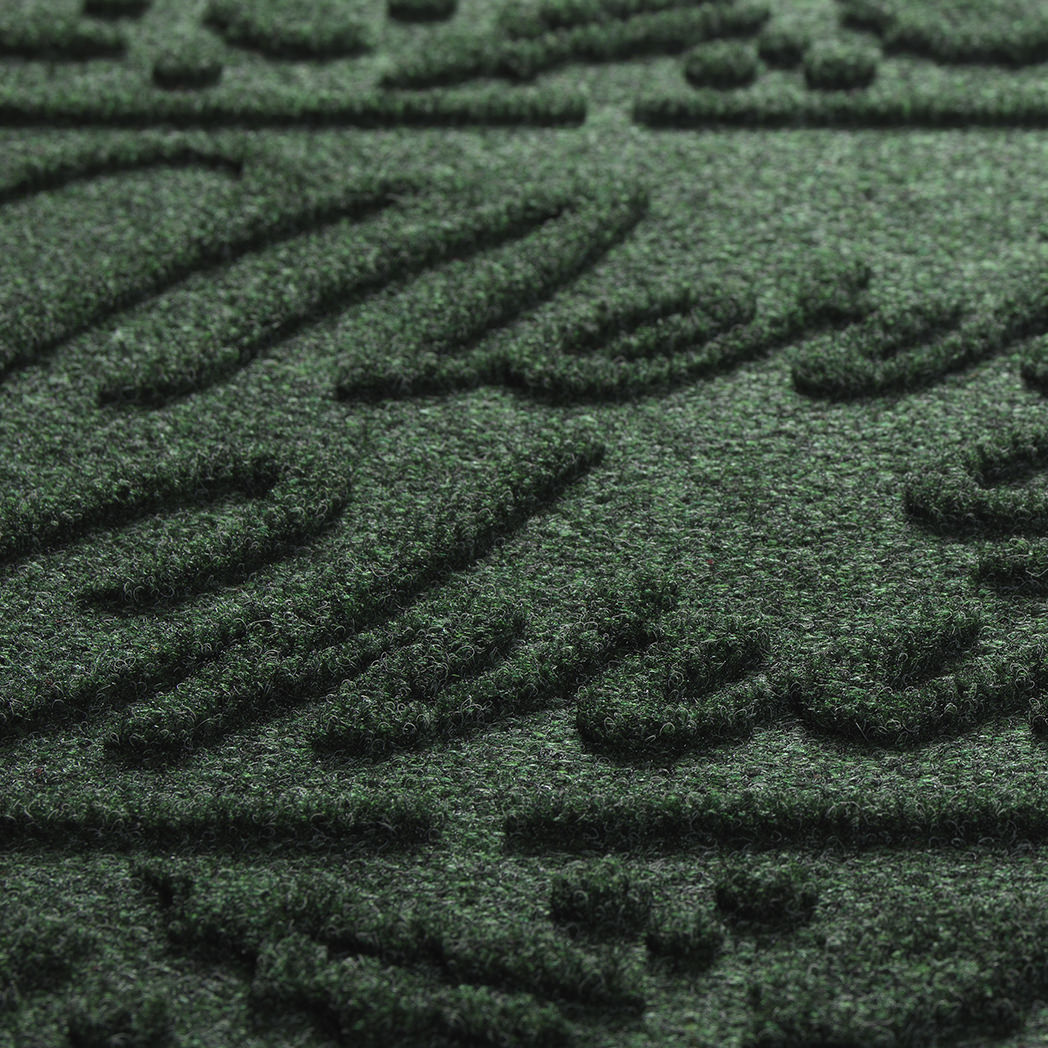 Close-up of the bi-level Merry Christmas text design in green made from eco-friendly fibers