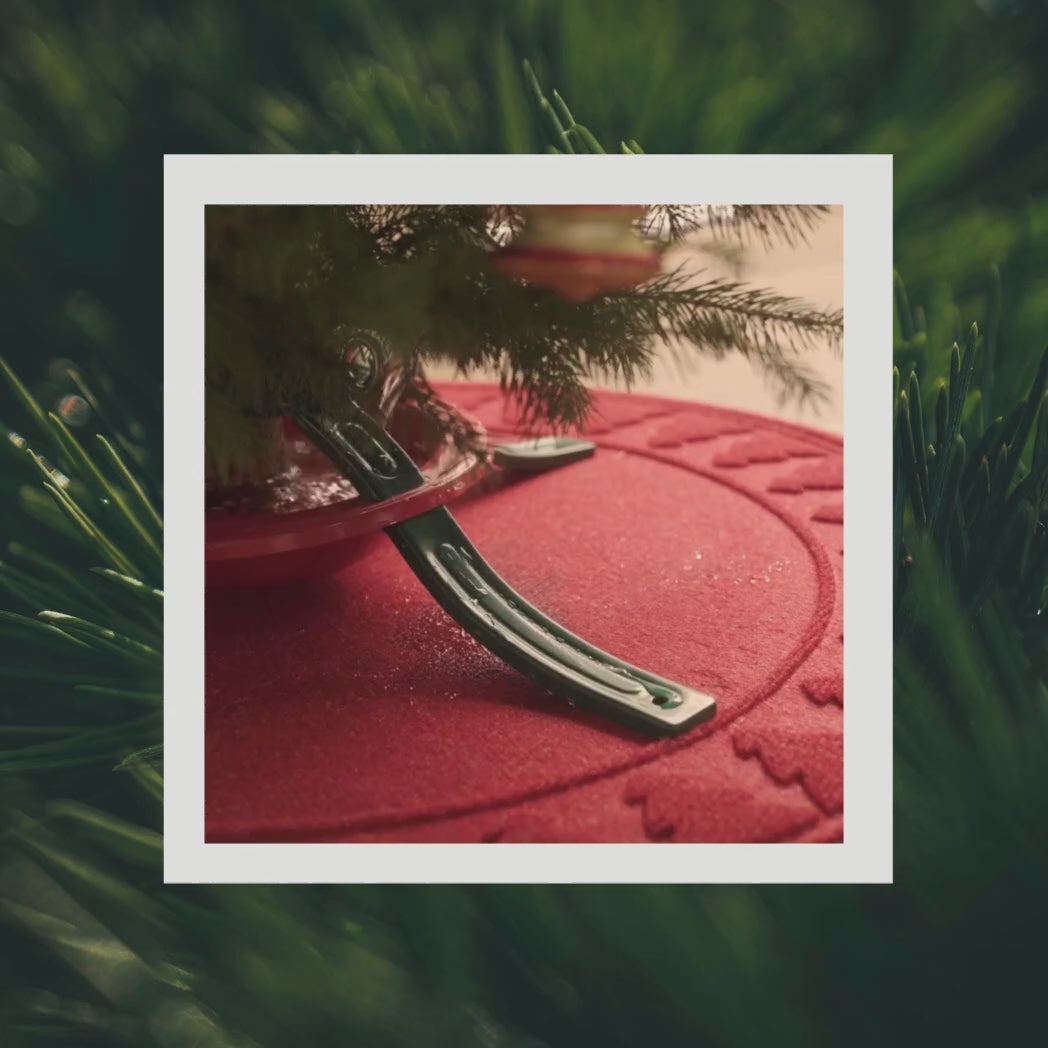 WaterHog catching and trapping spilled water from watering a Christmas tree to prevent wood rot and used for its fast drying surface