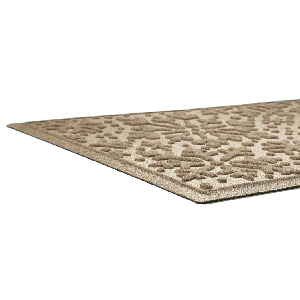 Textured low-profile mat with a geometric pattern on a white background