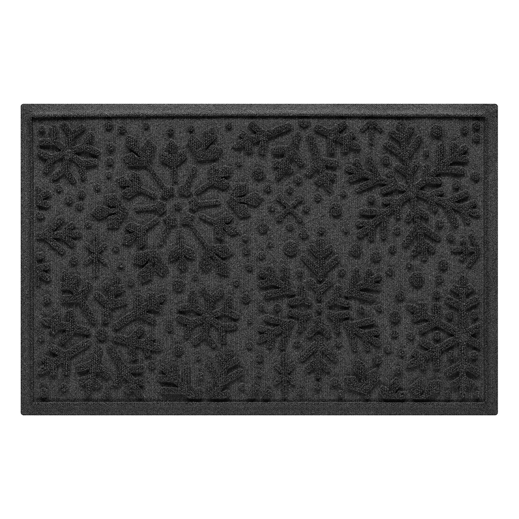 Dark grey doormat with snowflake pattern on a white background
