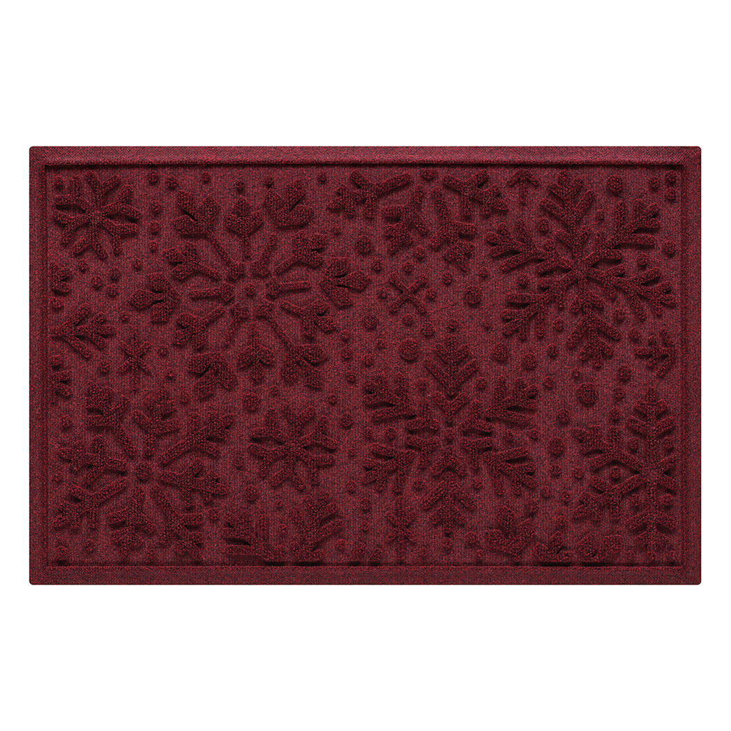 Deep red doormat with floral pattern on a white background