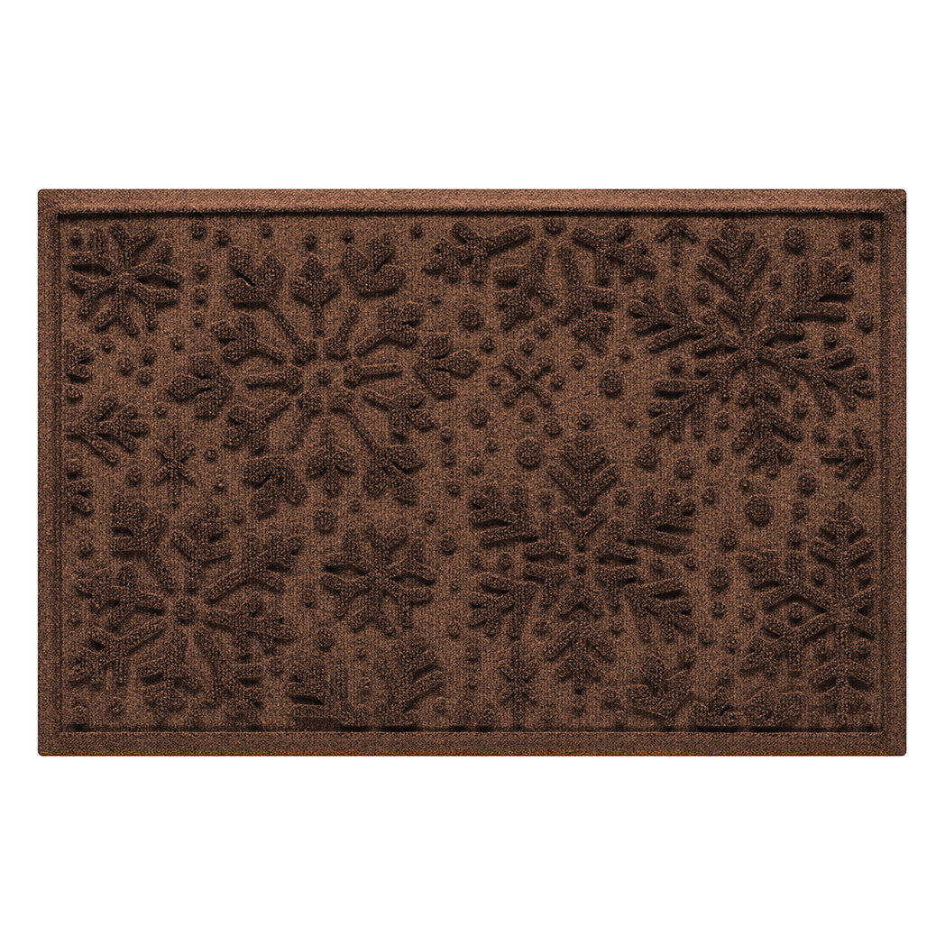 Brown doormat with a textured snowflake pattern on a white background