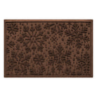 Brown doormat with a textured snowflake pattern on a white background