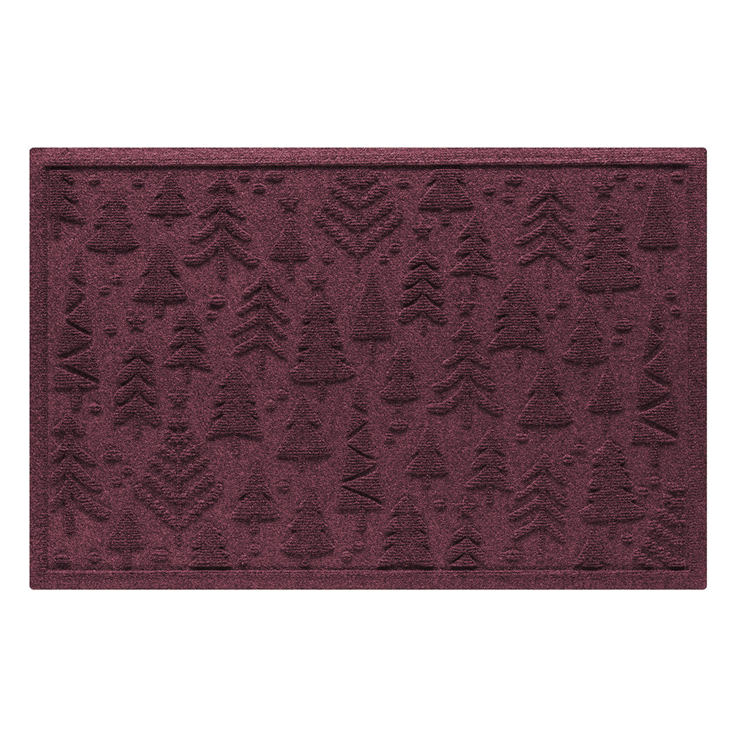 Deep red wine colored holiday doormat with tree pattern on a white background