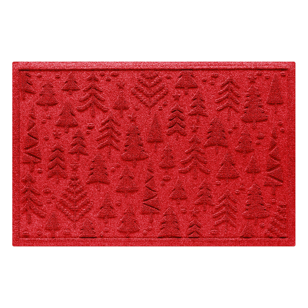 Bright red doormat with textured tree pattern on a white background