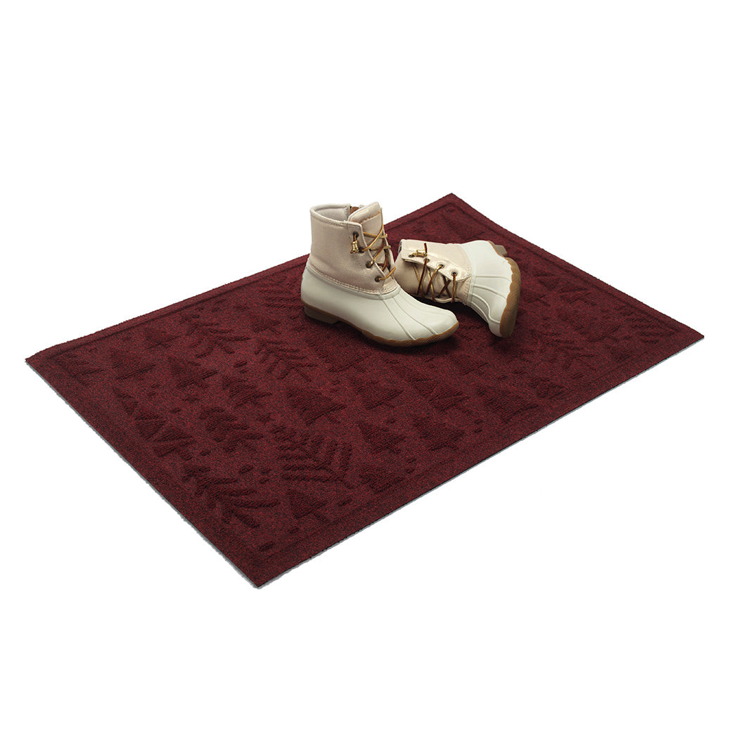 Dark red doormat with white boots on a white background
