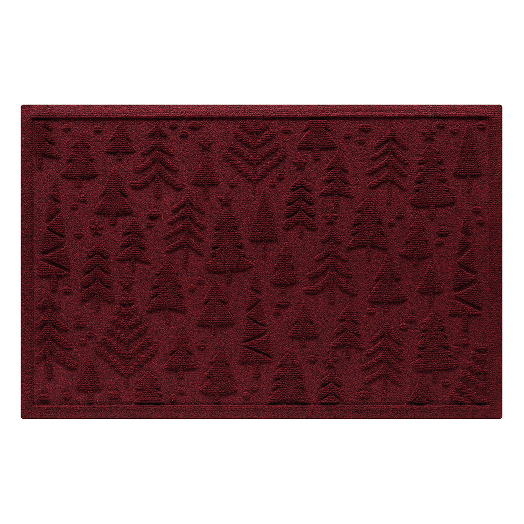 Deep red doormat with repeating tree pattern on a white background