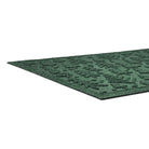 Green textured low-profile mat on a white background
