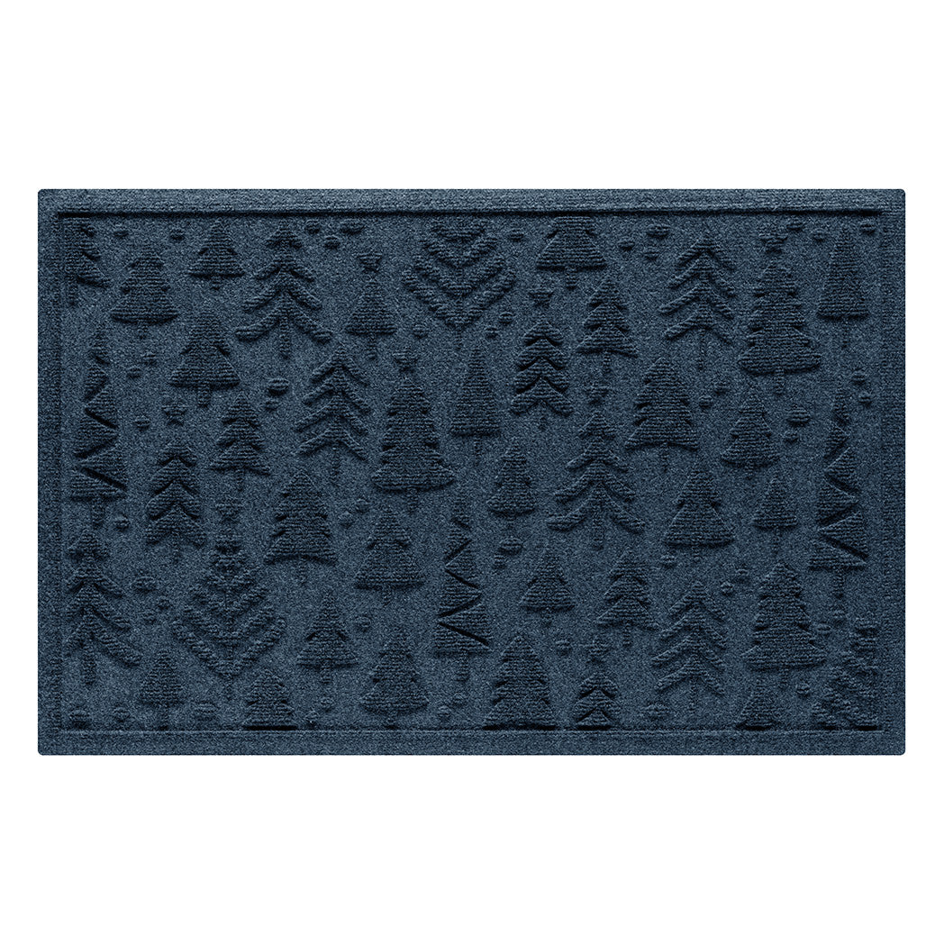 Navy blue doormat with holiday tree pattern on a white background