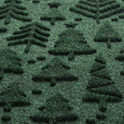 Close up of Tinsel Trail's bi-level, dirt-trapping surface in a deep evergreen made up of green, black, and grey fibers