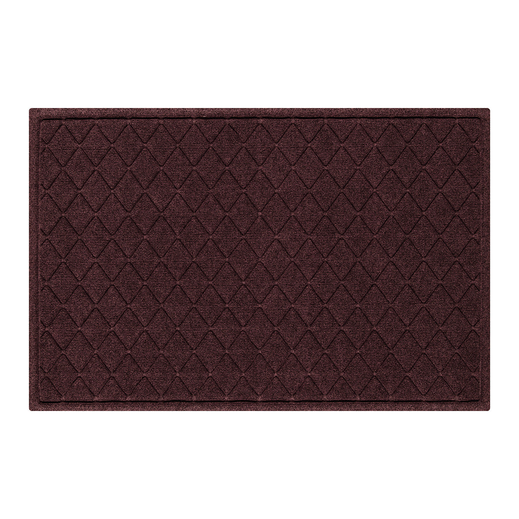Overhead of a large Argyle all-weather door mat with a deep wine red interlocking diamond, bi-level design for trapping dirt and debris from shoes.