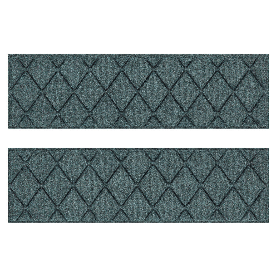 Overhead of a WaterHog Argyle fade-resistant stair treads in a light blue/grey interlocking diamond, bi-level design for a timeless appeal.