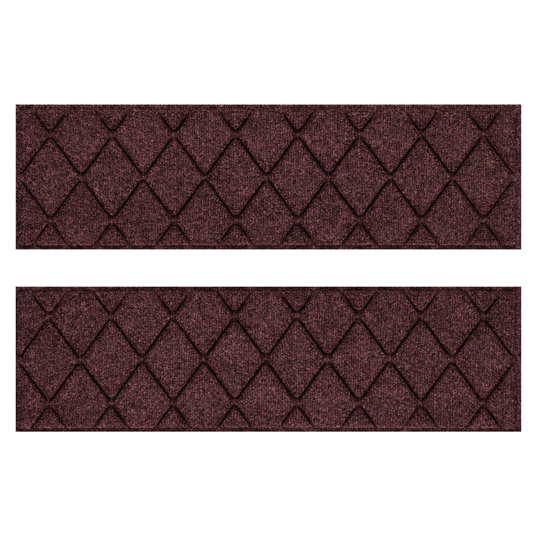 Pair of WaterHog Argyle water-resistant stair treads with a deep wine-red interlocking diamond design on a stain-resistant surface.