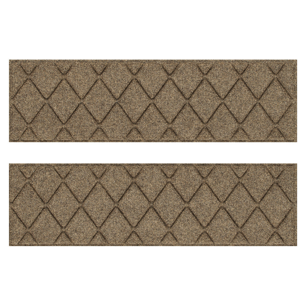 Overhead of a Pair of WaterHog Argyle indoor/outdoor stair treads in a light tan interlocking diamond, bi-level design for maximum scraping of shoes.