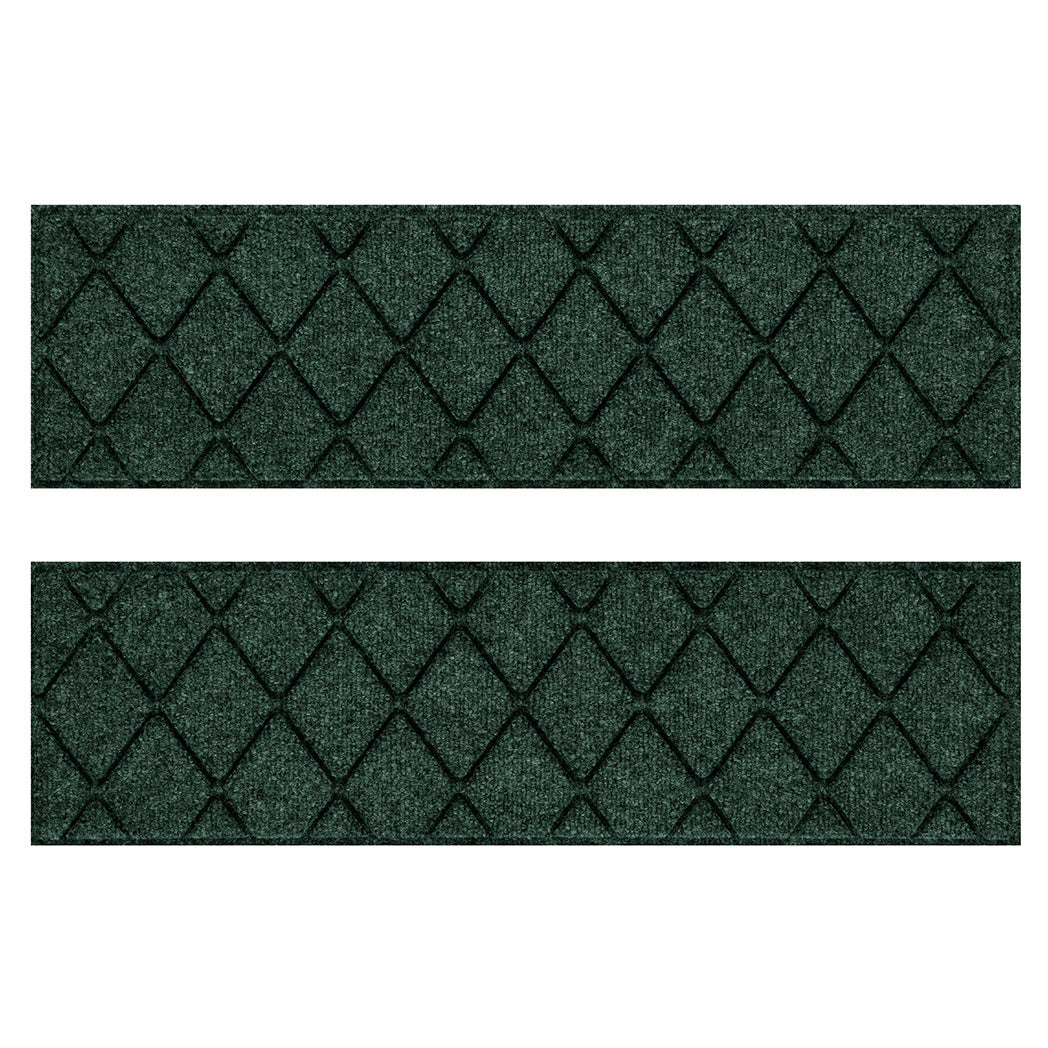 Overhead of a Pair of WaterHog Argyle water-resistant stair treads with a deep green, classic diamond design, all back from durable rubber.