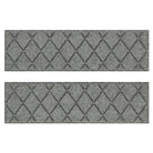 A pair of WaterHog grey indoor/outdoor stair treads are designed in an interlocking diamond pattern that is bi-level for maximum shoe scraping.
