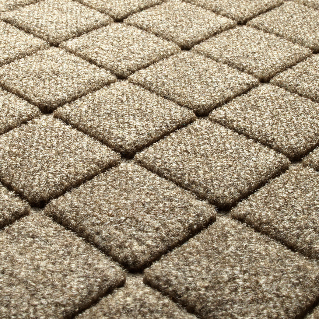 Zoomed-in image of Argyle's light tan surface making a fade and stain-resistant surface and timeless design.
