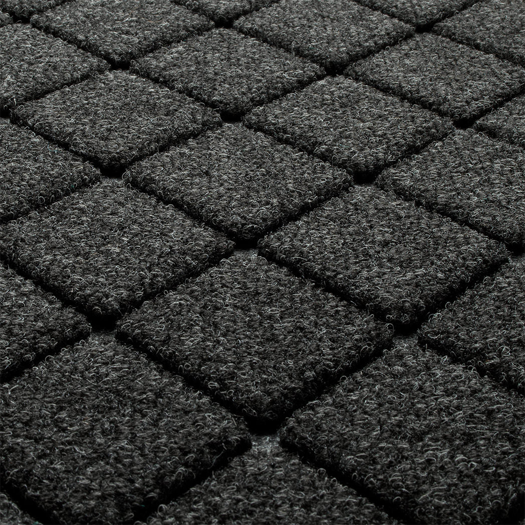 Blown-up view of WaterHog's the eco-friendly surface fibers made of various shades of grey to black, with hints of white fibers.