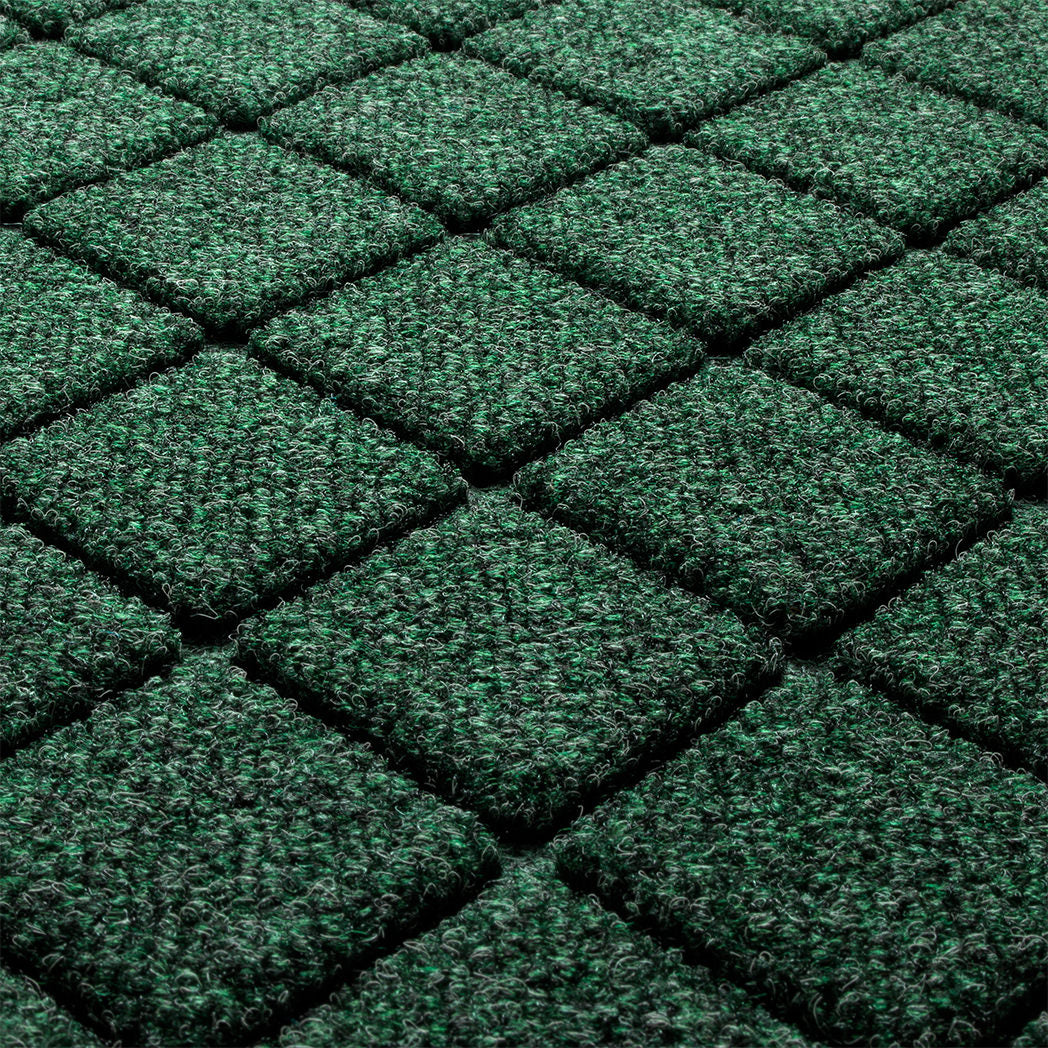 Close-up of the stain-resistant WaterHog surface made of green, white, and grey fibers pressed into a bi-level design for maximum cleaning.