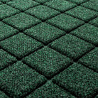 Close-up of the stain-resistant WaterHog surface made of green, white, and grey fibers pressed into a bi-level design for maximum cleaning.