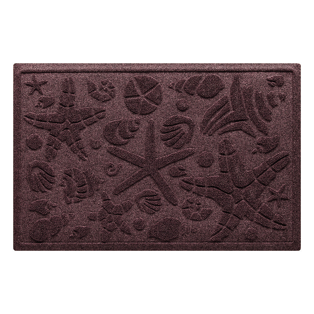 Isolated image of a coastal themed WaterHog Beachcomber medium size indoor/outdoor doormat that features a unique pattern of sea shells and starfish. Shown in dark red color.