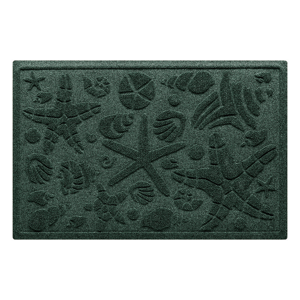 Isolated image of a nautical themed WaterHog Beachcomber medium size indoor/outdoor doormat that features a unique pattern of sea shells and starfish. Shown in dark evergreen color.