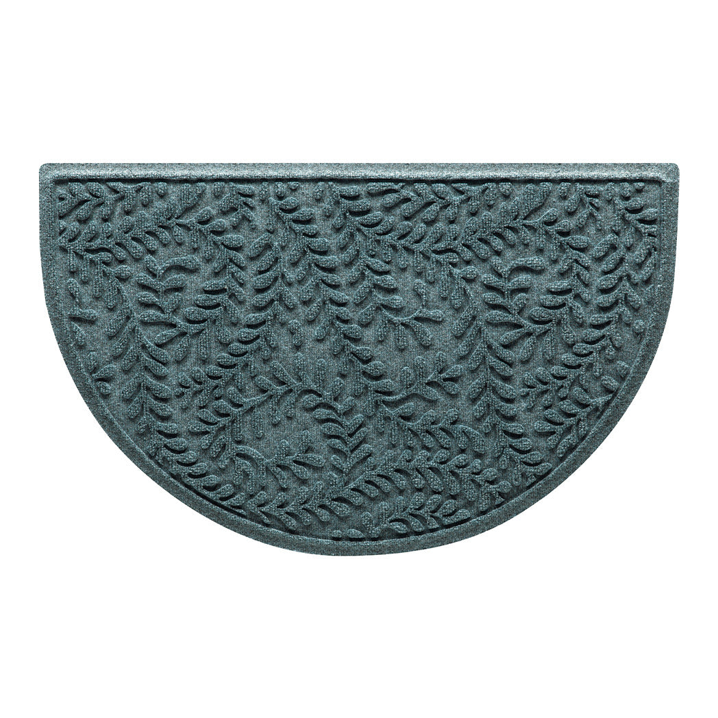 Overhead of a WaterHog Boxwood half-round doormat in a light blue/grey curling botanical pattern.