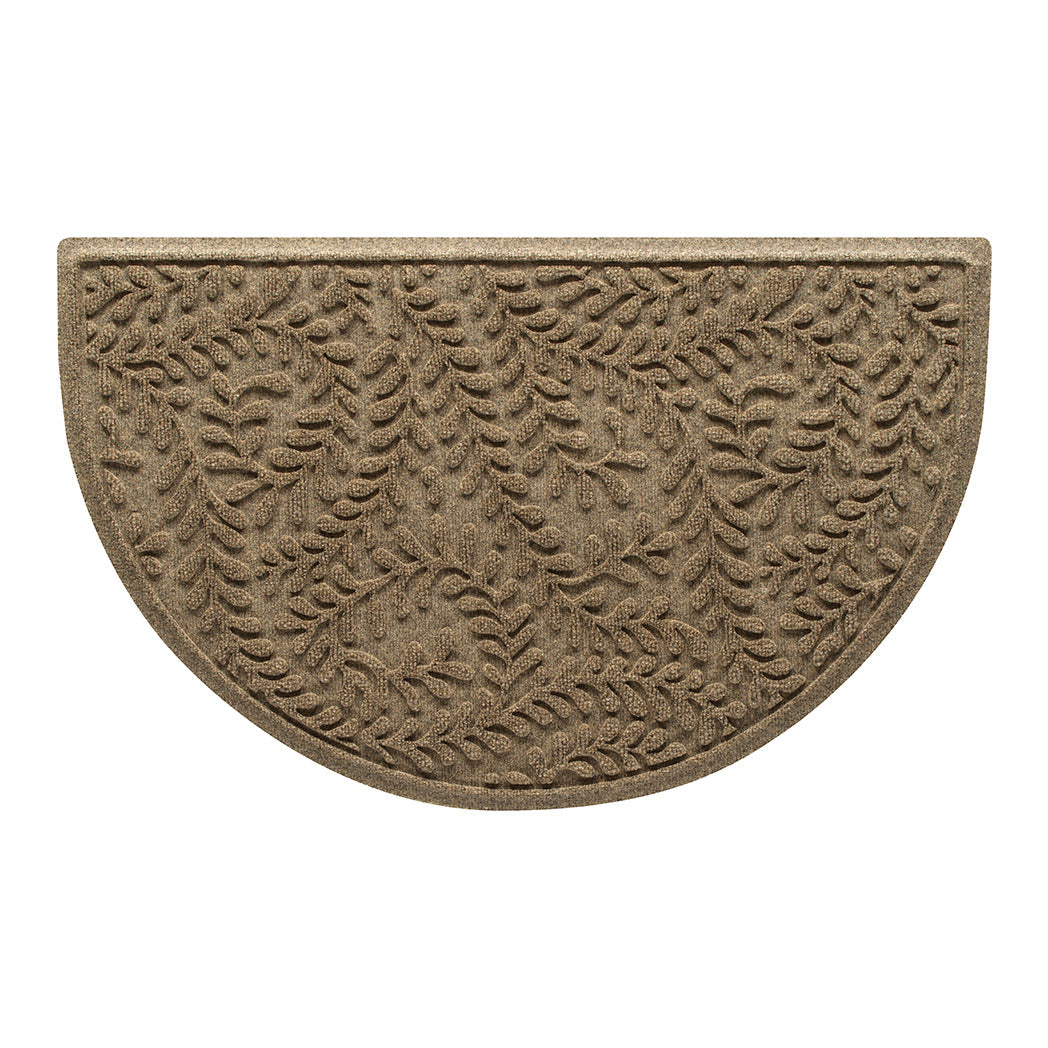 An OG WaterHog indoor/outdoor half-round doormat with a light tan curling botanical, bi-level design.