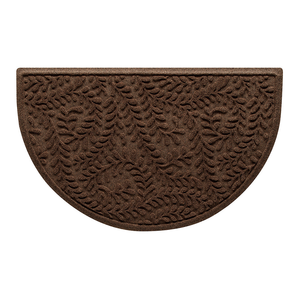 Overhead of a WaterHog Boxwood outdoor half-round doormat in a dark earthy brown curling botanical pattern.