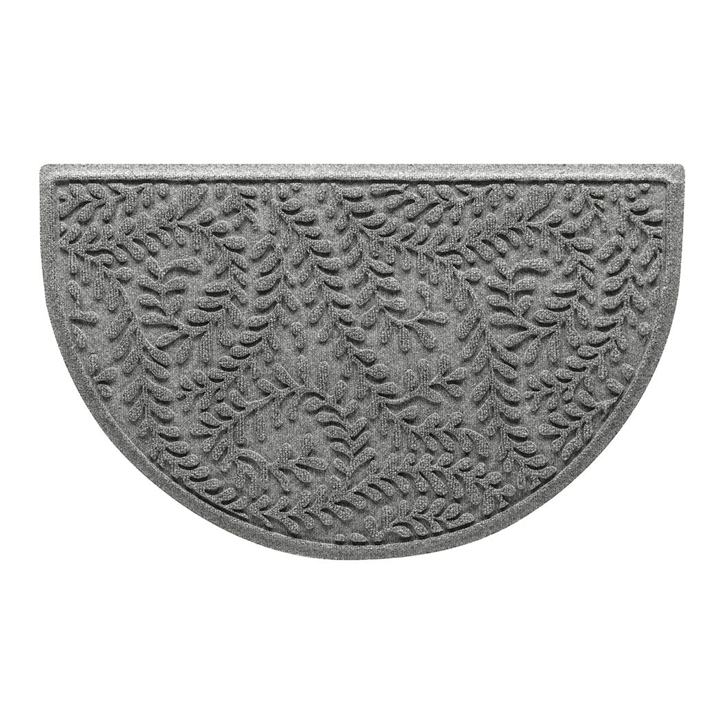 WaterHog Boxwood indoor/outdoor luxury half-round doormat in a light grey surface and curling botanical pattern.