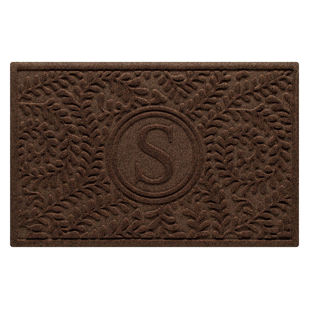 Monogrammed WaterHog medium stylish doormat in a dark earthy brown curling botanical pattern.