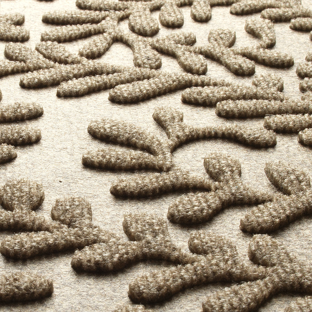 Zoomed-in view Boxwood's camel surface making a fade and stain-resistant surface, making a viney, leafy pattern.